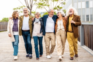 A group of people walking together and laughing.