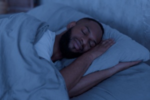 Man asleep in bed.